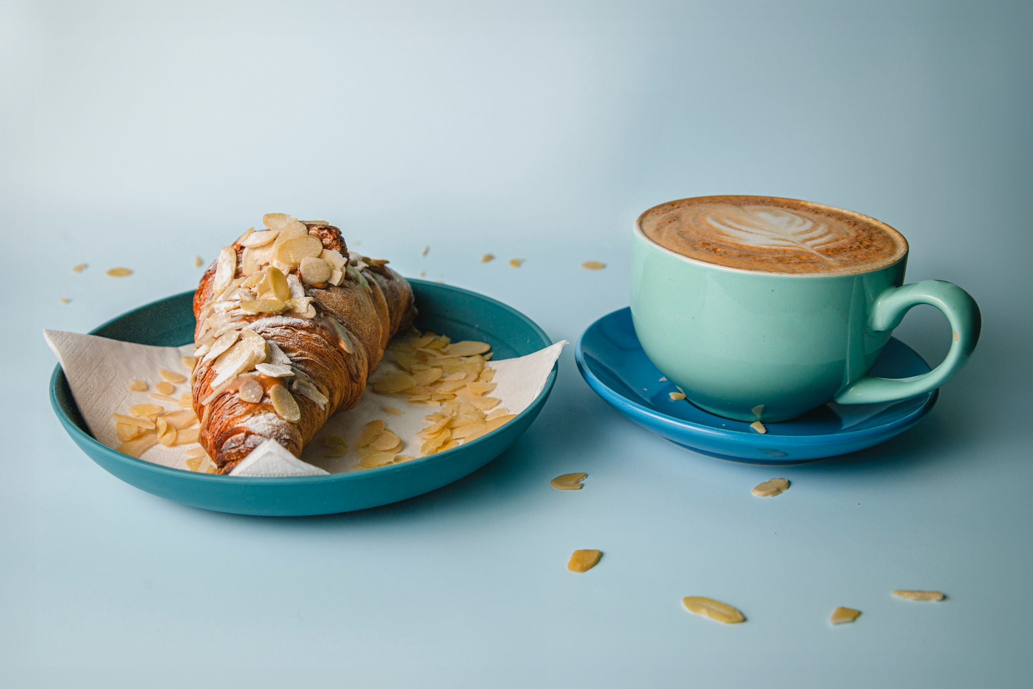 Freshly baked croissant with barista made coffee